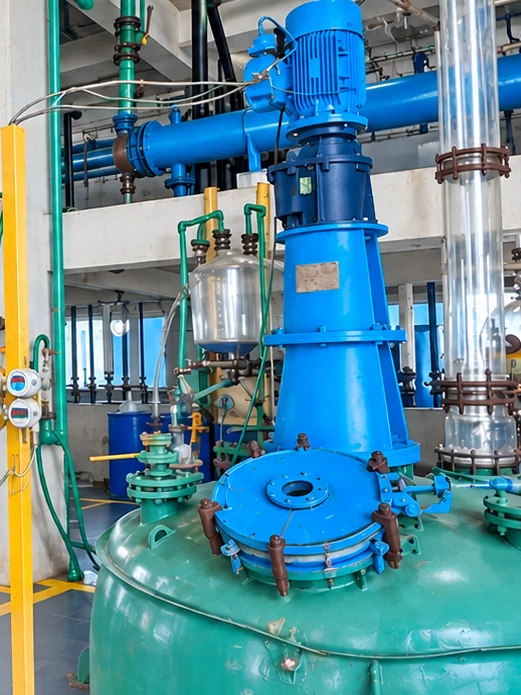 A glass-lined reactor with its agitator drive in the Harvin labs reactor hall